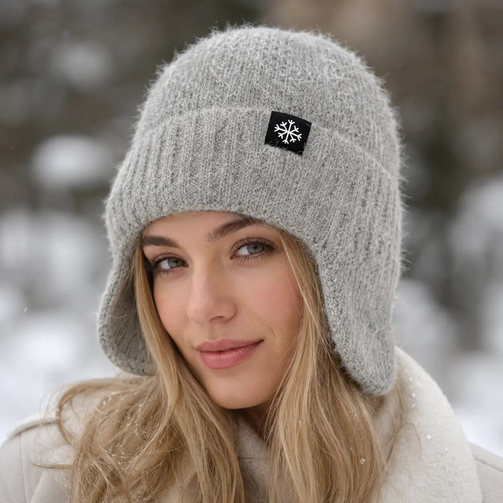 Women's knit beanie with faux fur earflaps