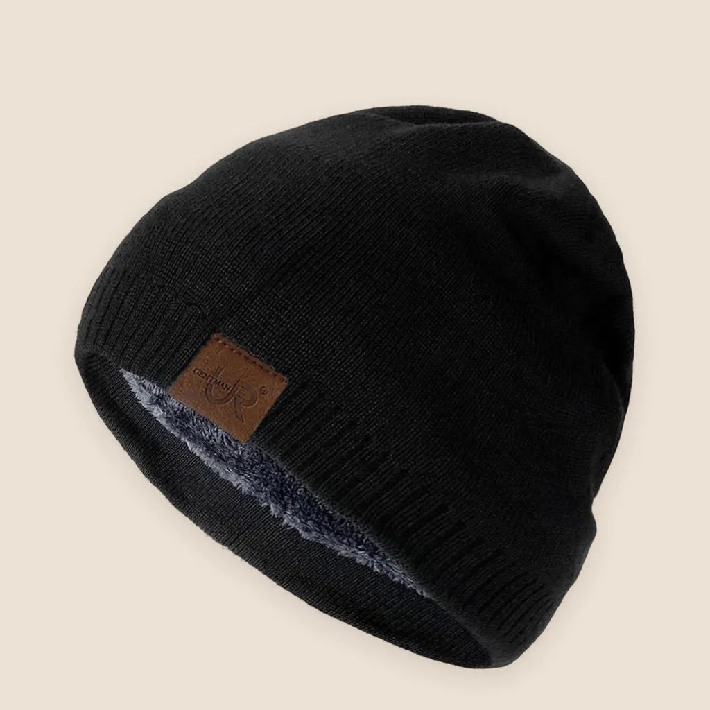 Unisex fleece lined knit beanie on a warm neutral background