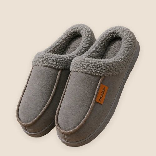 Men's suede house slippers with TPR sole on a warm neutral background