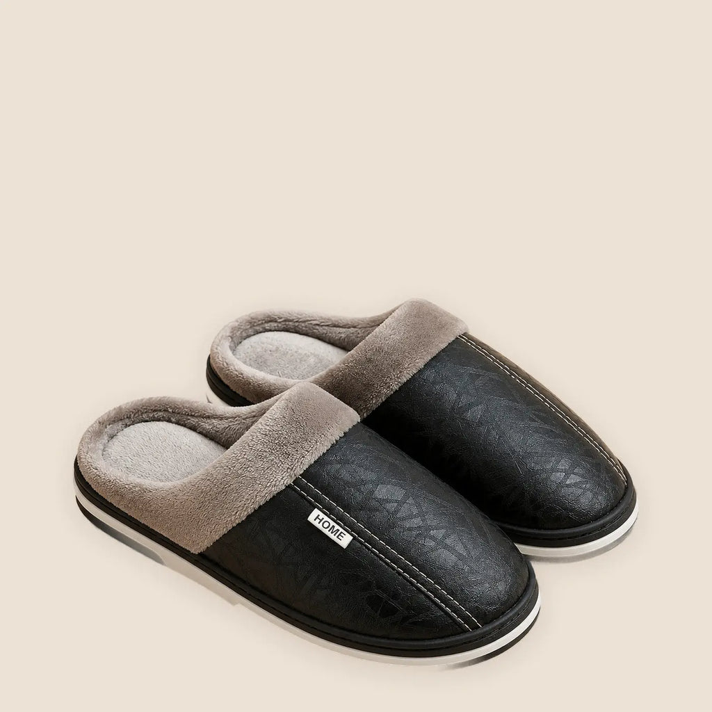 Men's waterproof faux leather house slippers on a warm neutral background
