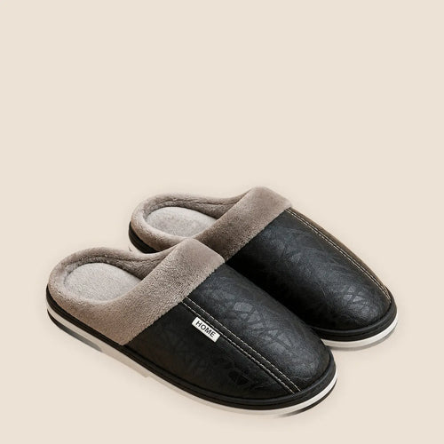 Men's waterproof faux leather house slippers on a warm neutral background