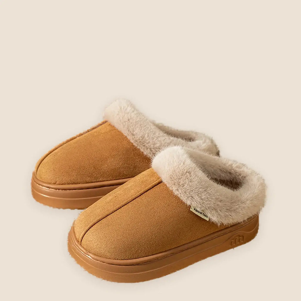 Women's faux leather slipper boots on a warm neutral background
