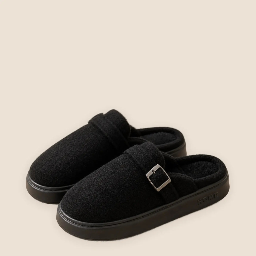 Women's soft sole indoor slippers on a warm neutral background